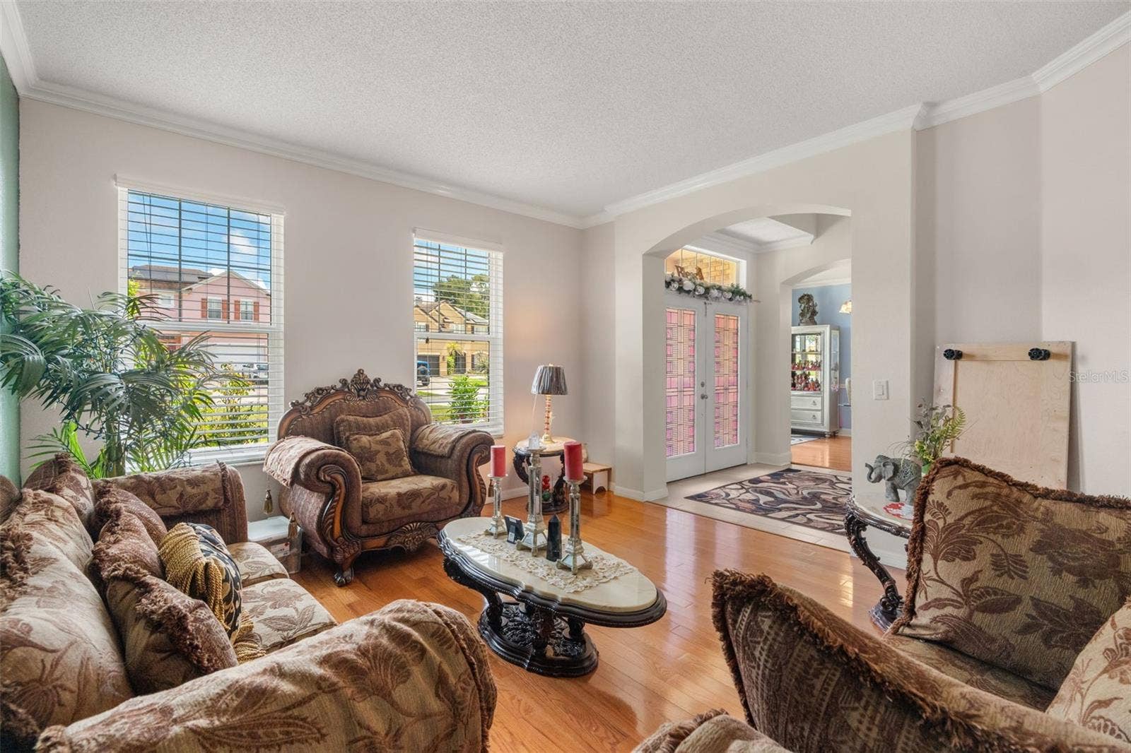 211 HUNT STREET, Clermont, FL 34711 Additional view of the sitting area featuring large windows and an open layout.