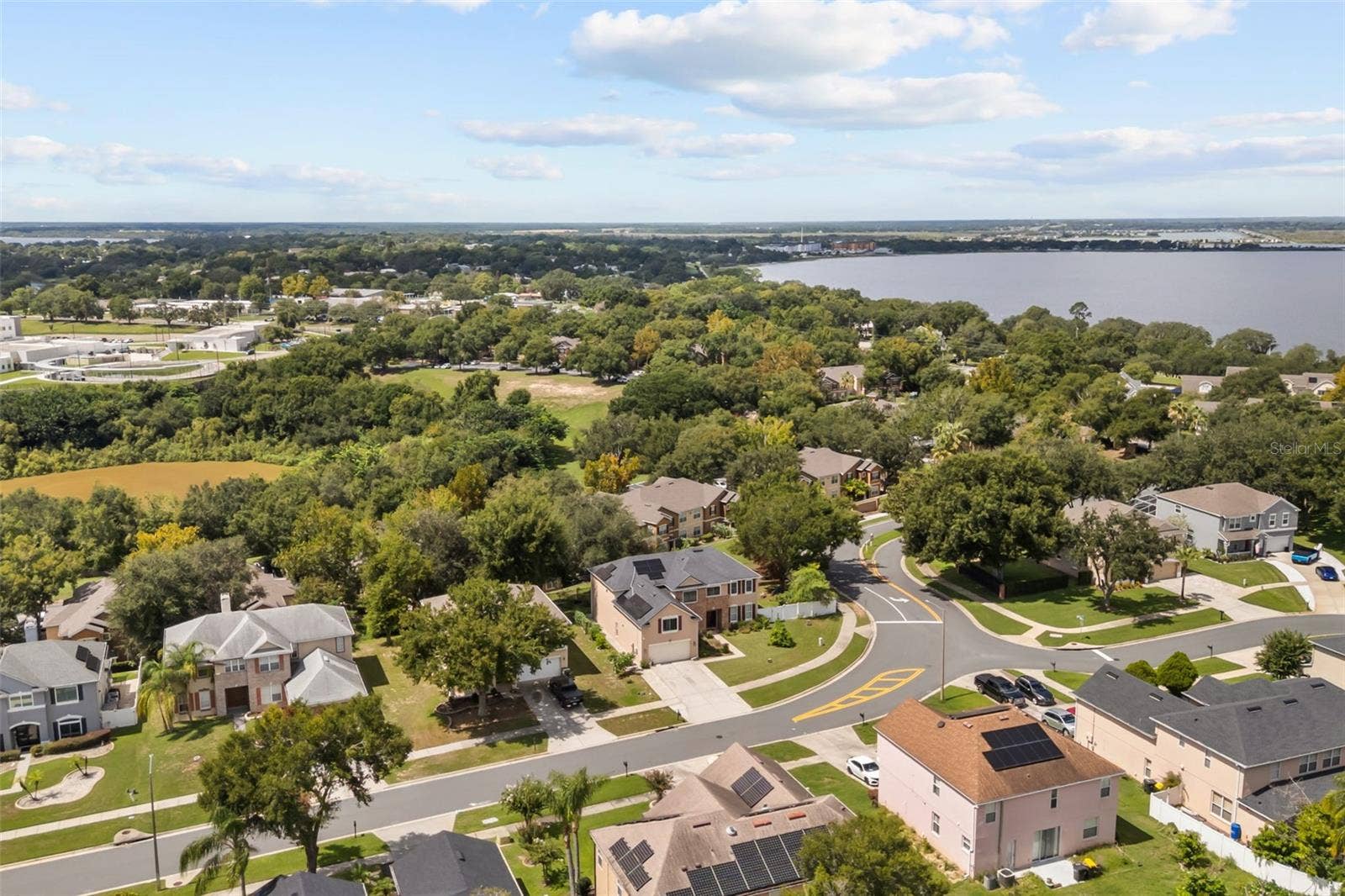 211 HUNT STREET, Clermont, FL 34711 Aerial view of the surrounding neighborhood and nearby community.