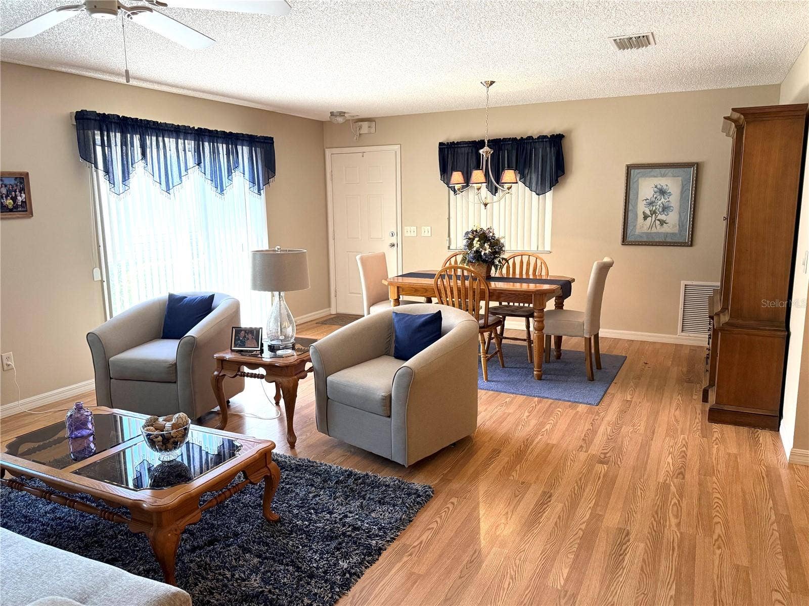 16878 SE 94TH SUNNYBROOK CIRCLE, The Villages, FL 32162 Living room looking back towards front door