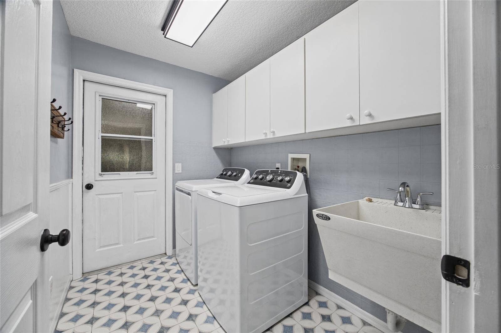 3081 E BERWICK COURT, Hernando, FL 34442 Inside Laundry room with storage closet, cabinets and sink