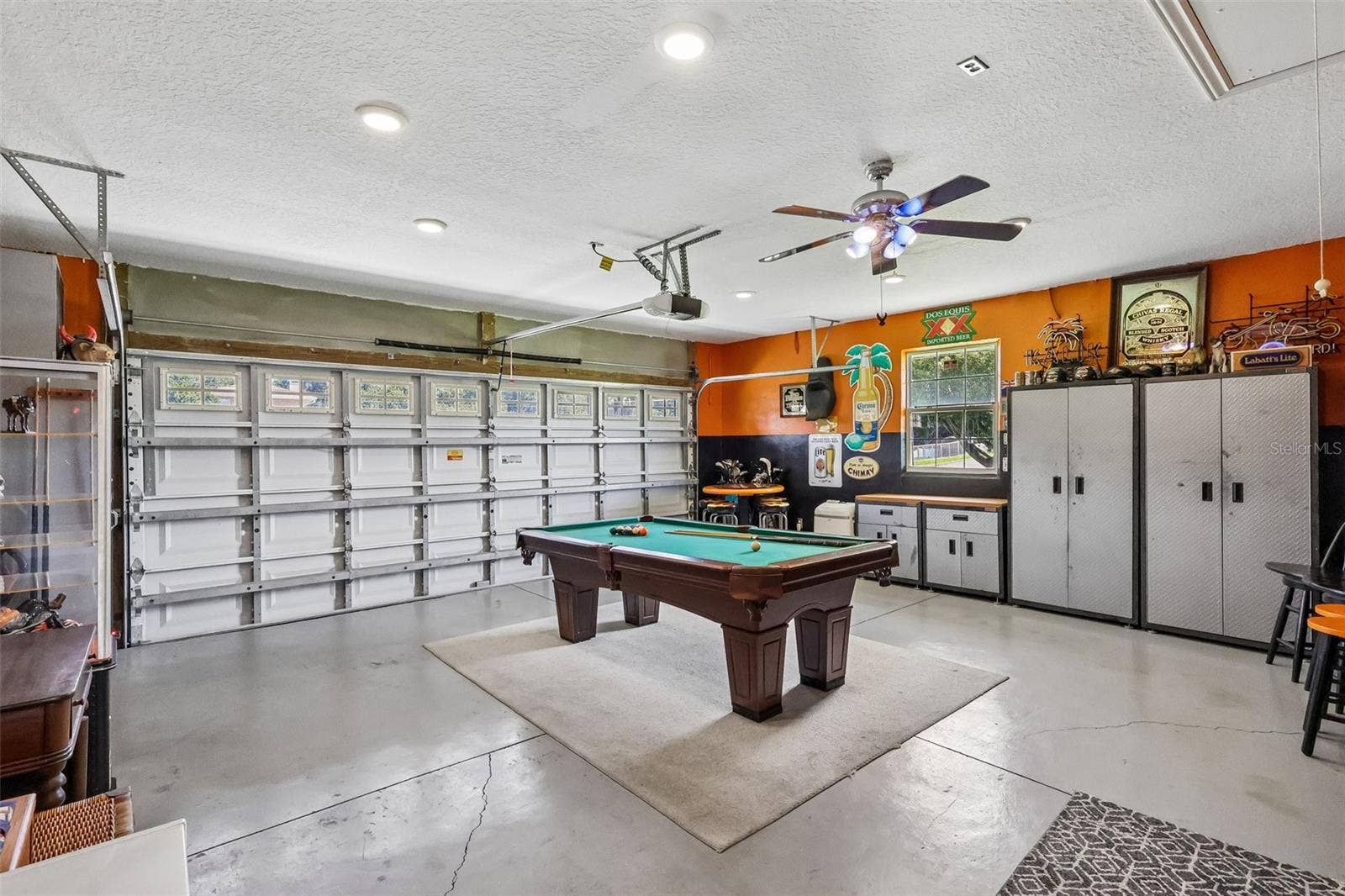 28116 LOIS DRIVE, Tavares, FL 32778 Work shop and Billiard table /Owner had designed with your favorite motorcycle decor and never used for cars, but it can always go back to being "Just a Garage"