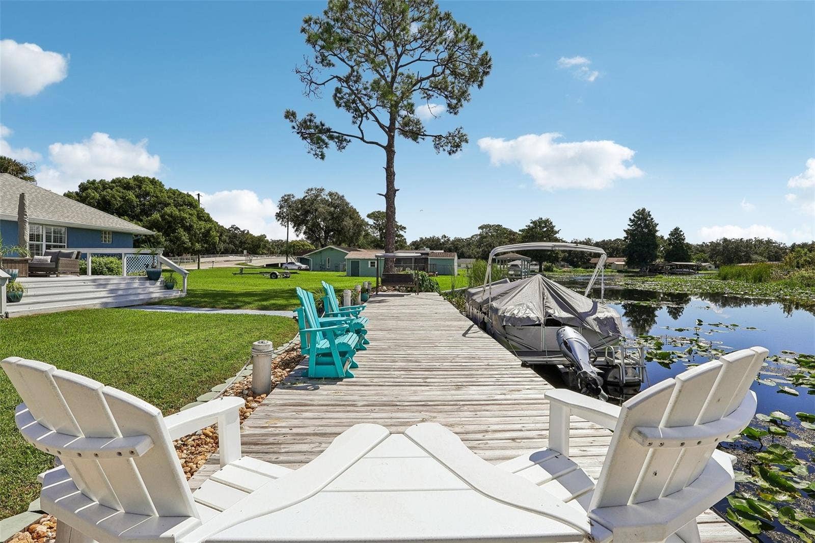 28116 LOIS DRIVE, Tavares, FL 32778 66 x 10 foot treated and secured deck/ dock runs along the canal