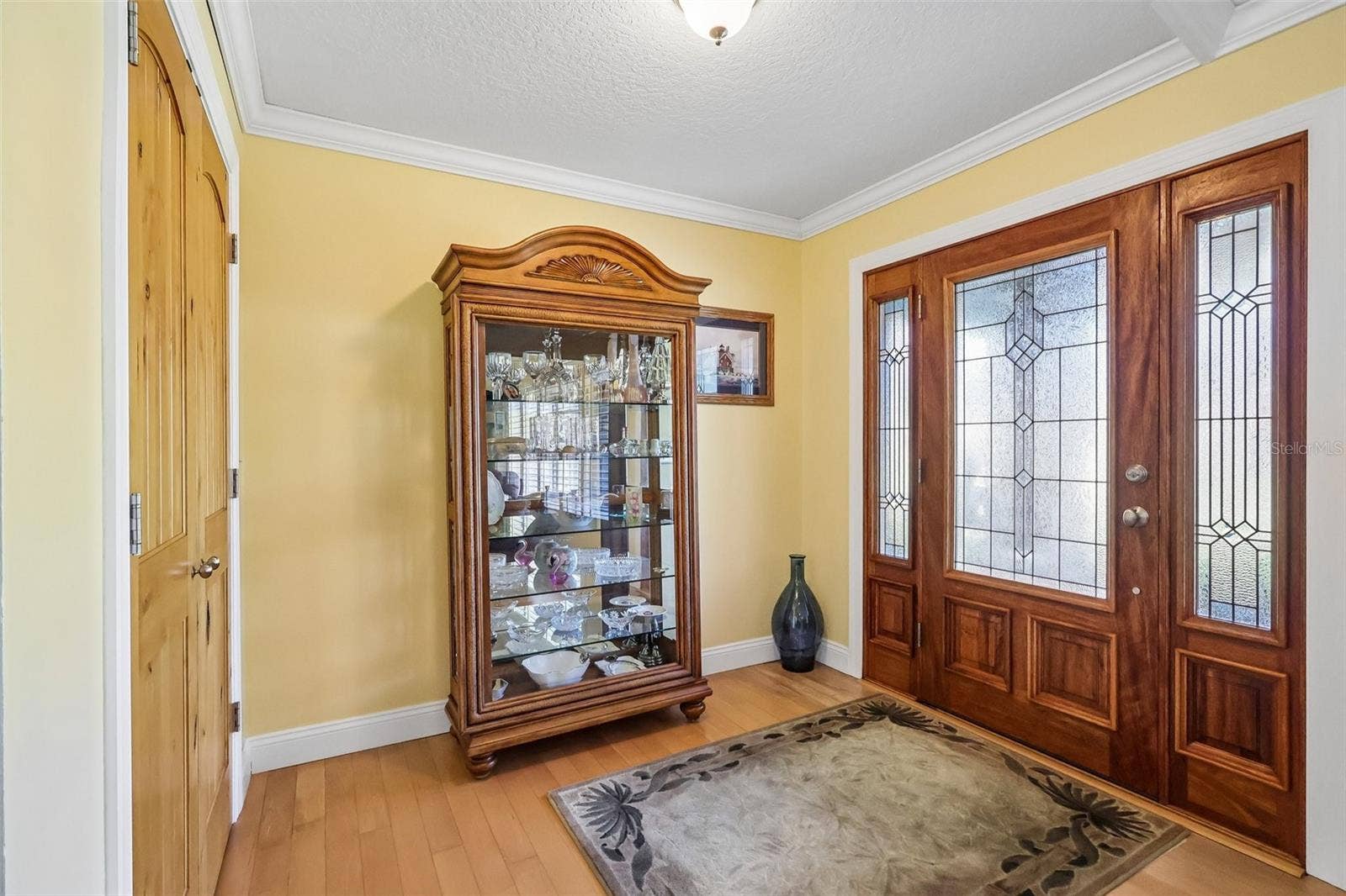28116 LOIS DRIVE, Tavares, FL 32778 Foyer with large coat closet/ all wooden solid doors through out the home