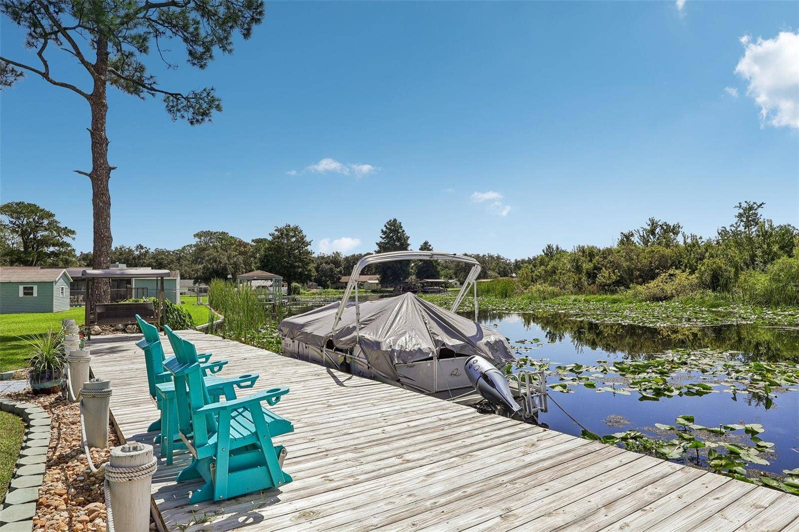 28116 LOIS DRIVE, Tavares, FL 32778 Sunsets and sunrises are amazing here, wide and deep canal leads to Lake Beauclaire and Lake Dora and Mount Dora to the rest of the Harris Chain of Lakes...a Boaters delight!