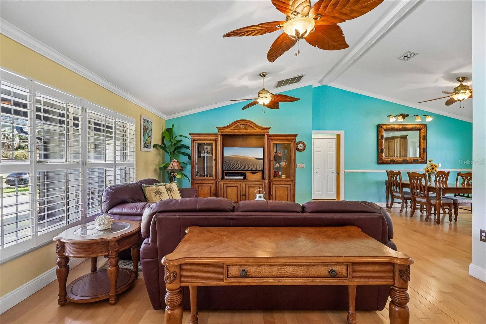 28116 LOIS DRIVE, Tavares, FL 32778 Living area with high ceilings and beautiful matching fans, and solid wood floors through out