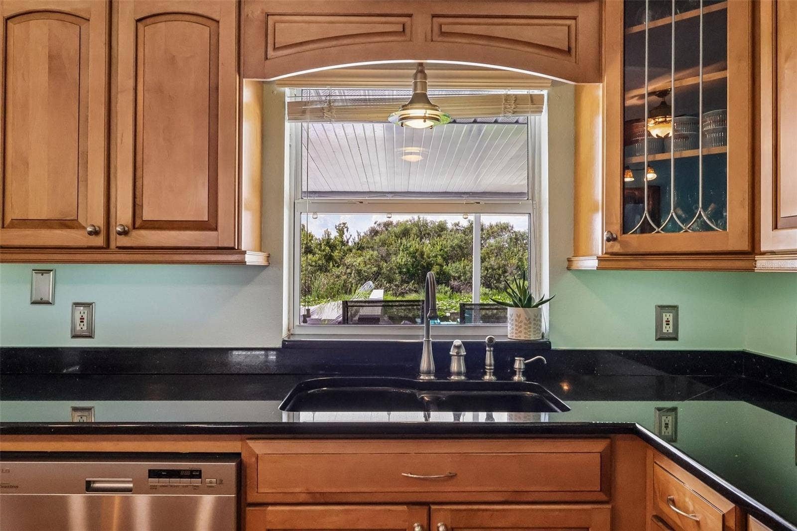 28116 LOIS DRIVE, Tavares, FL 32778 Kitchen window looking out to canal and decks