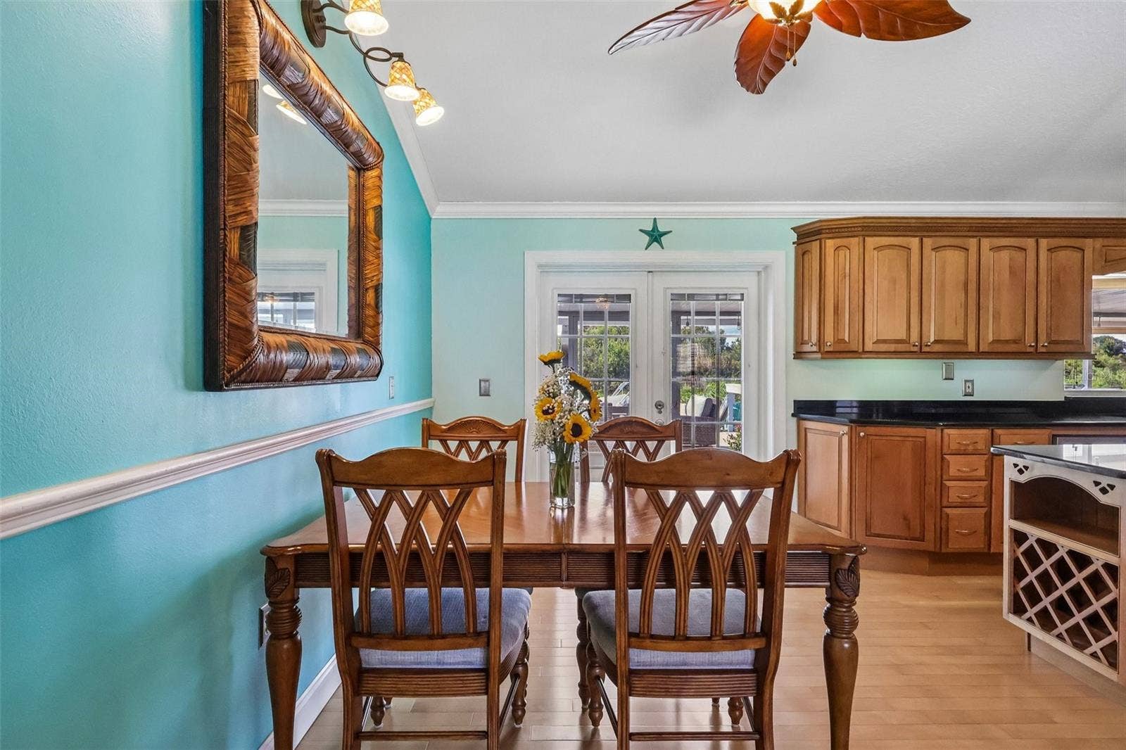 28116 LOIS DRIVE, Tavares, FL 32778 Dining area with French doors with blinds inserts to screened in Patio and beyond