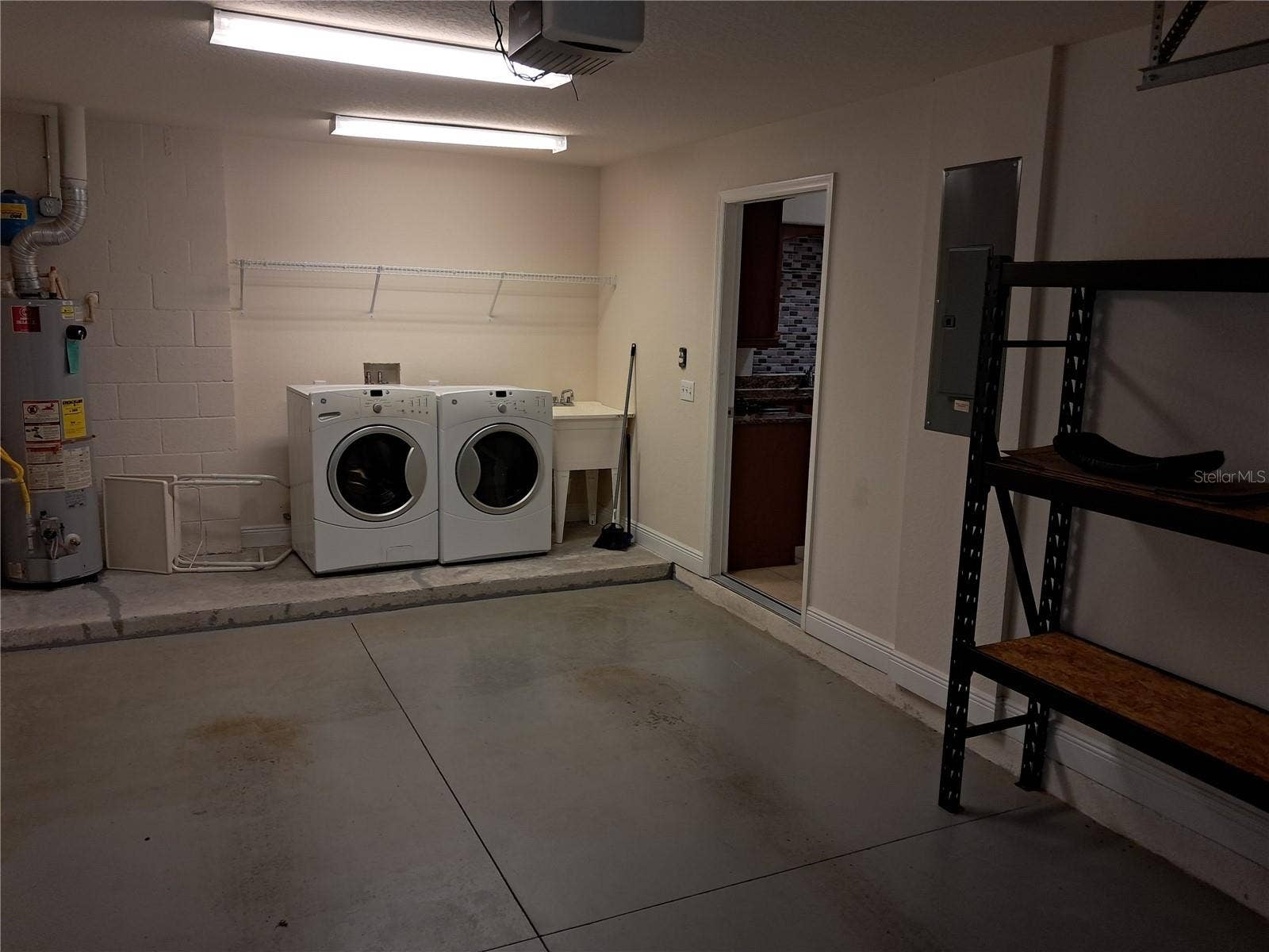 1083 DAVID WALKER DRIVE, #C3, Tavares, FL 32778 Garage with washer and dryer