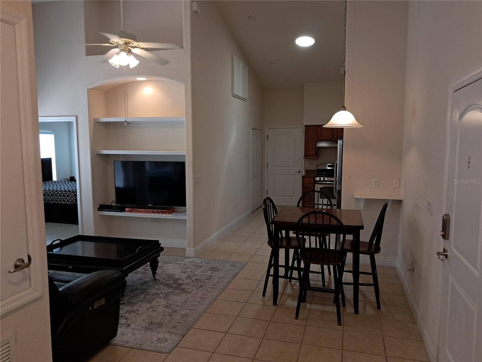 1083 DAVID WALKER DRIVE, #C3, Tavares, FL 32778 Den to dinning to kitchen