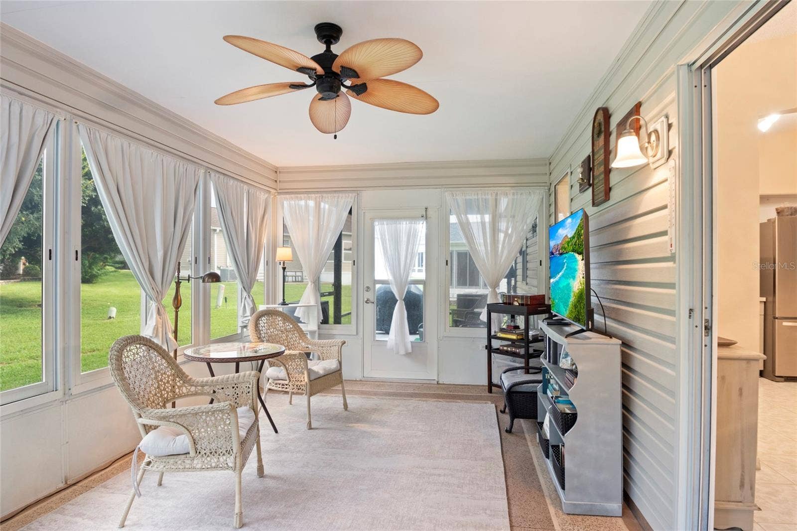 672 SAN PEDRO DRIVE, The Villages, FL 32159 Specious Florida Room, painted concrete flooring.