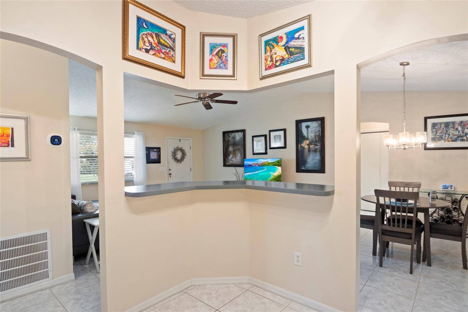 672 SAN PEDRO DRIVE, The Villages, FL 32159 Open Bar Area from Kitchen to Living/Dining Areas