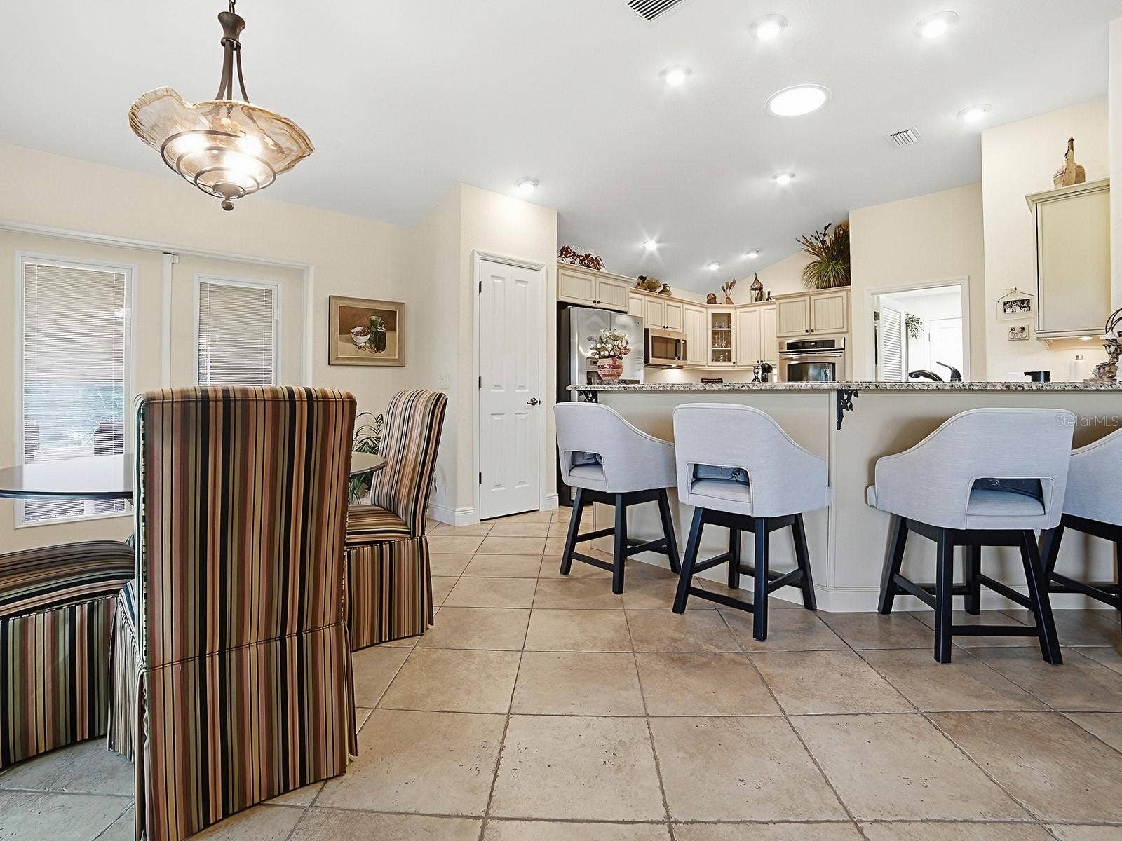 EAT IN KITCHEN AREA AND BREAKFAST BAR WITH VIEW TO KITCHEN