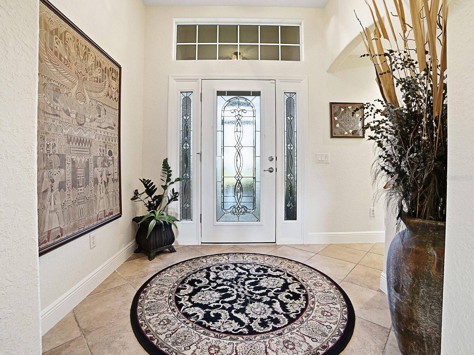 YOUR GRAND ENTRYWAY WITH NATURAL LIGHT AND LEADED GLASS DOOR