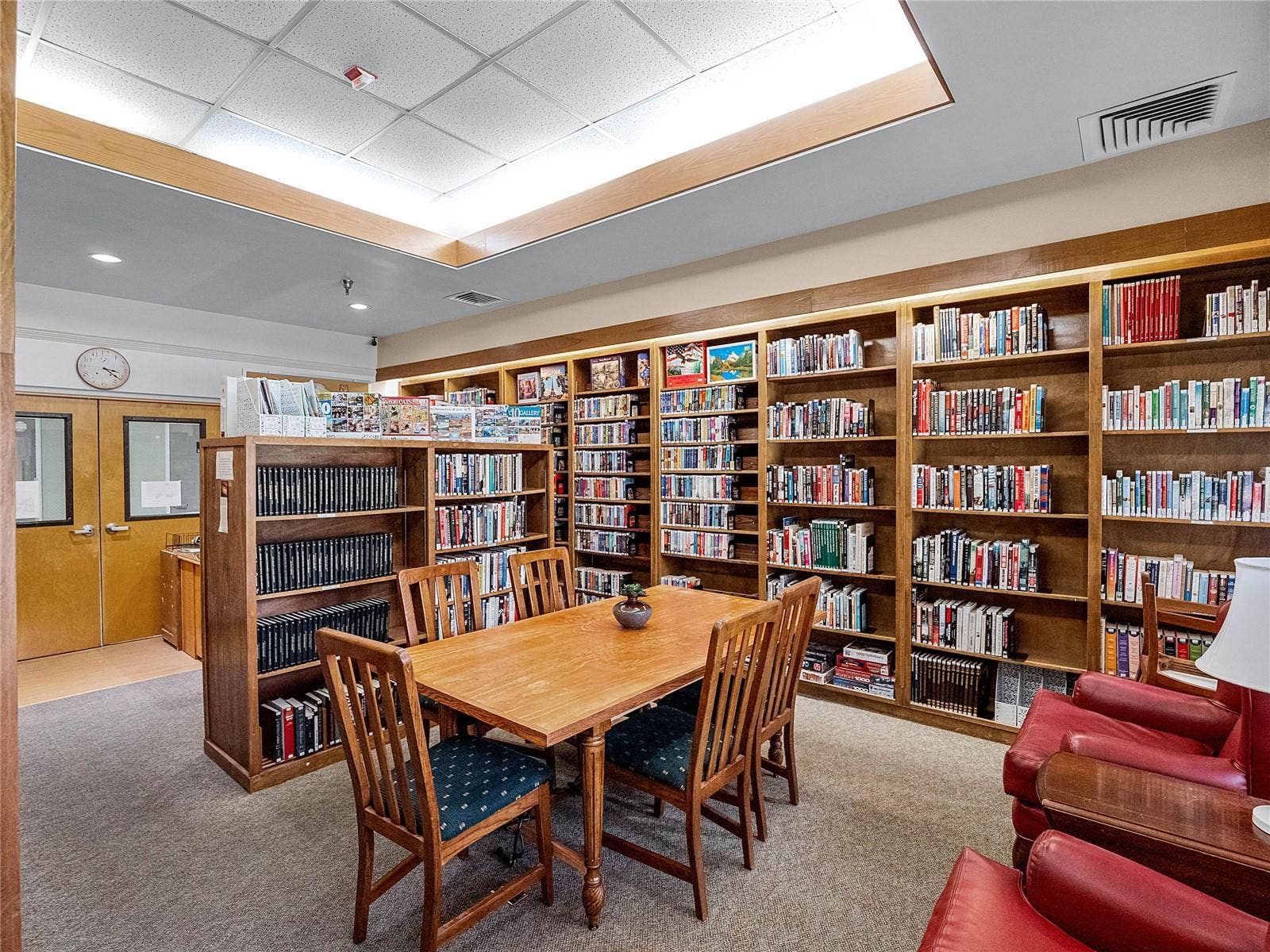library holds many books, puzzles and movies