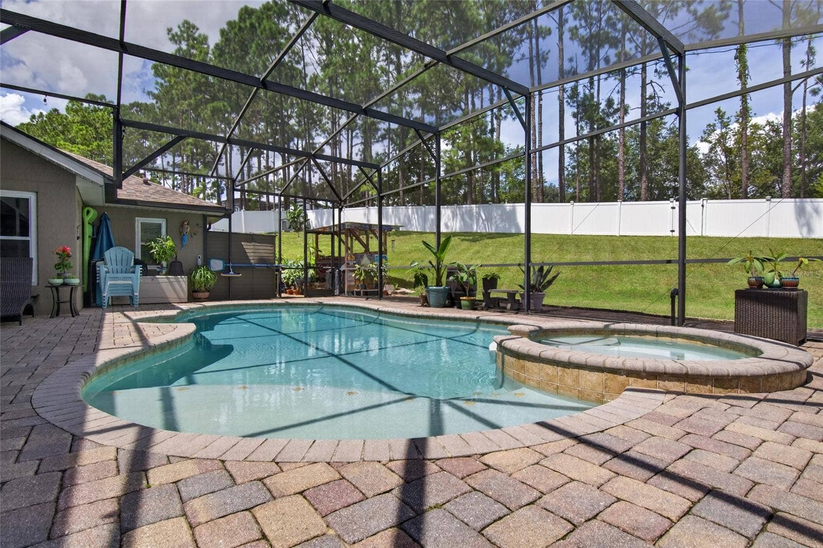 Screened and heated saltwater pool and spa