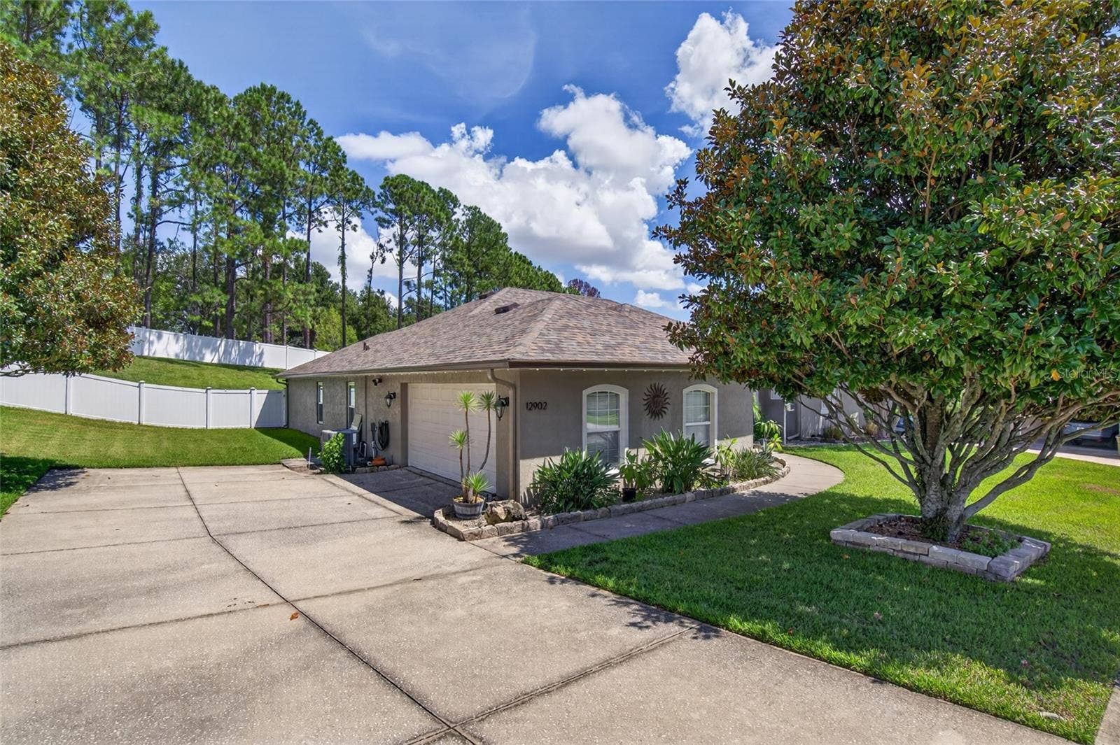 Large, extended driveway and side-entry two-car garage