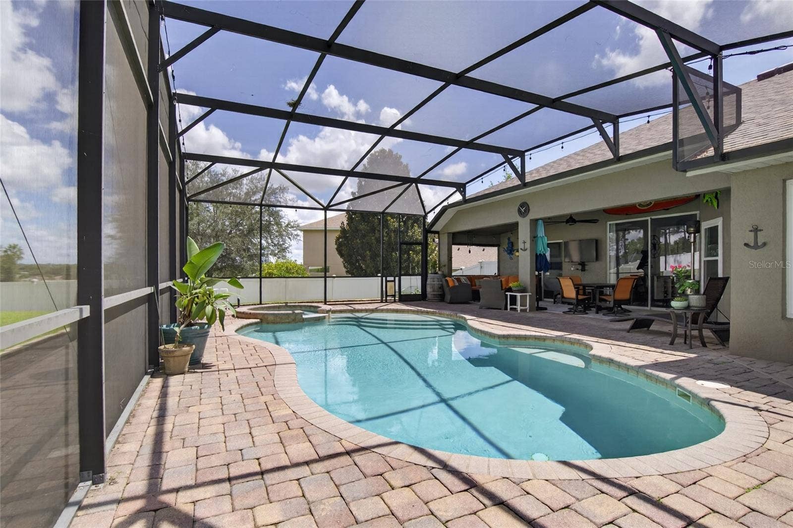 Screened and heated saltwater pool and spa
