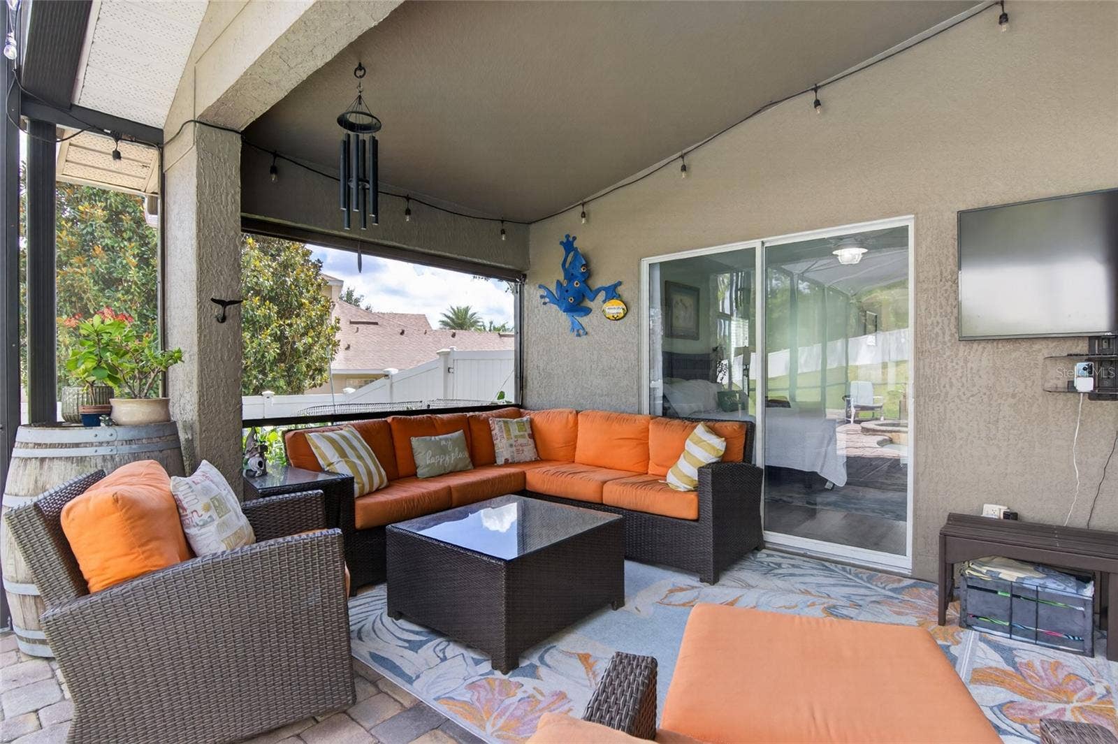 Covered lanai area w/ roll down shade