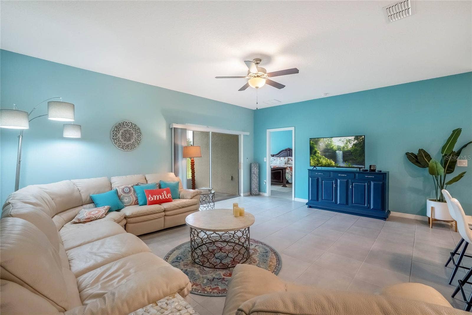 4400 BEDFORD WAY, Leesburg, FL 34748 Great Room. Patio Doors lead to screened porch