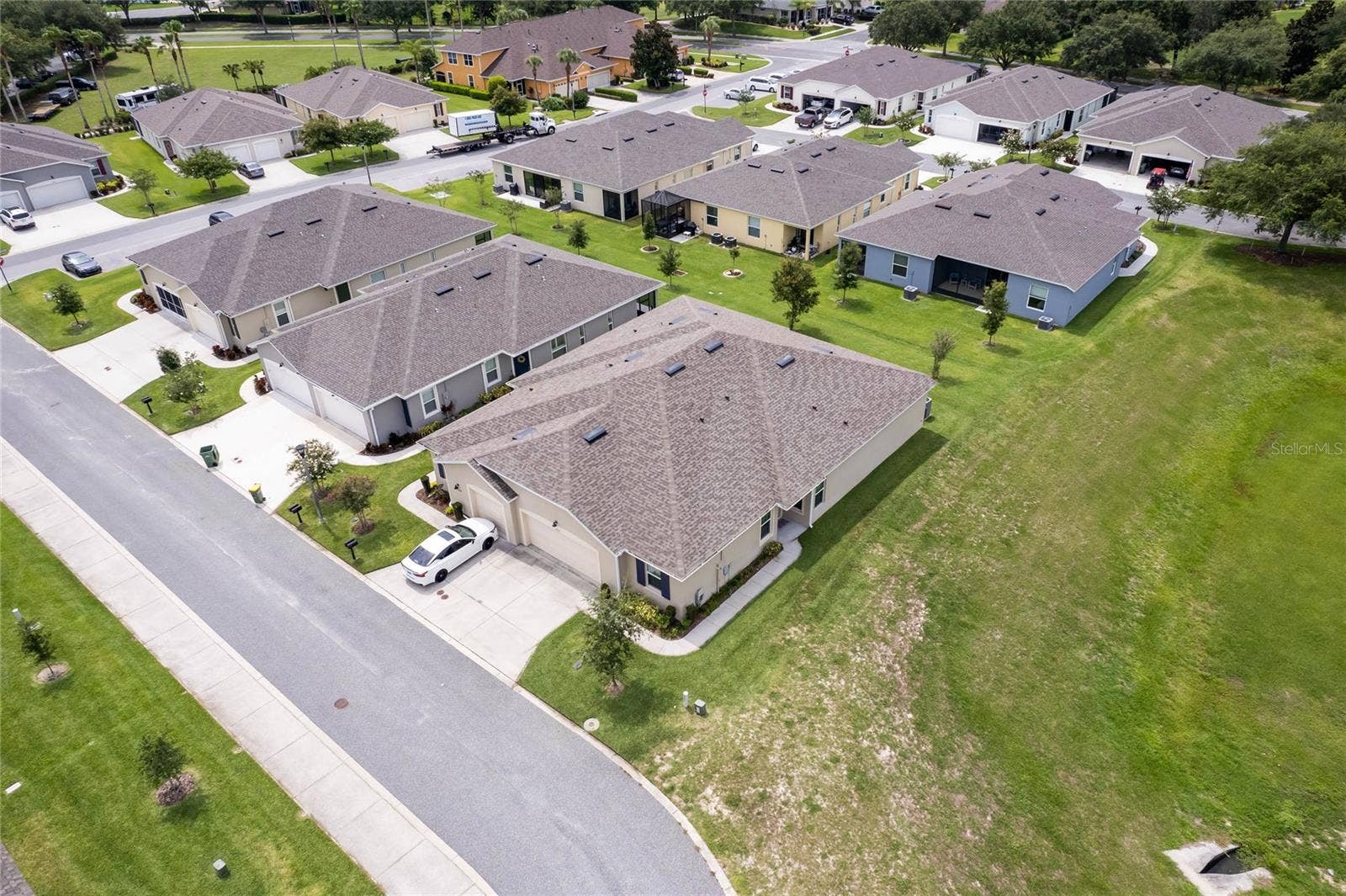 4400 BEDFORD WAY, Leesburg, FL 34748 Villa on the right. Double car driveway and 20x20 garage with overhead storage.