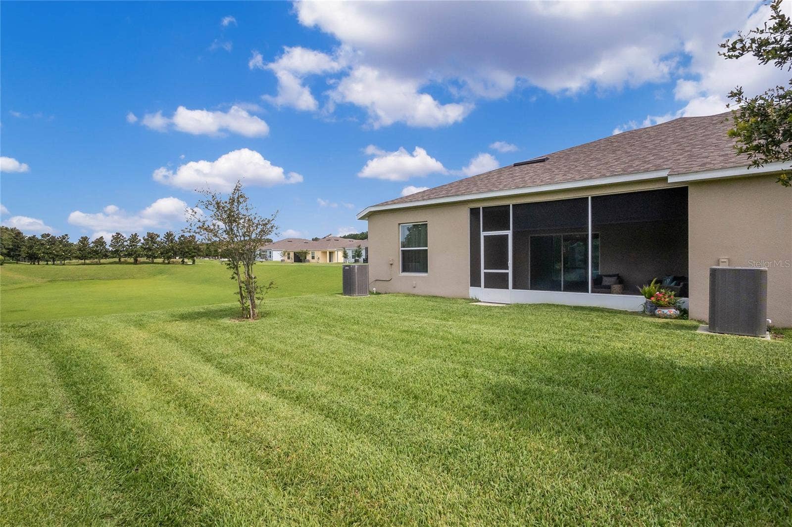 4400 BEDFORD WAY, Leesburg, FL 34748 Back of home. No neighbors on side and view of golf course and sunset views.
