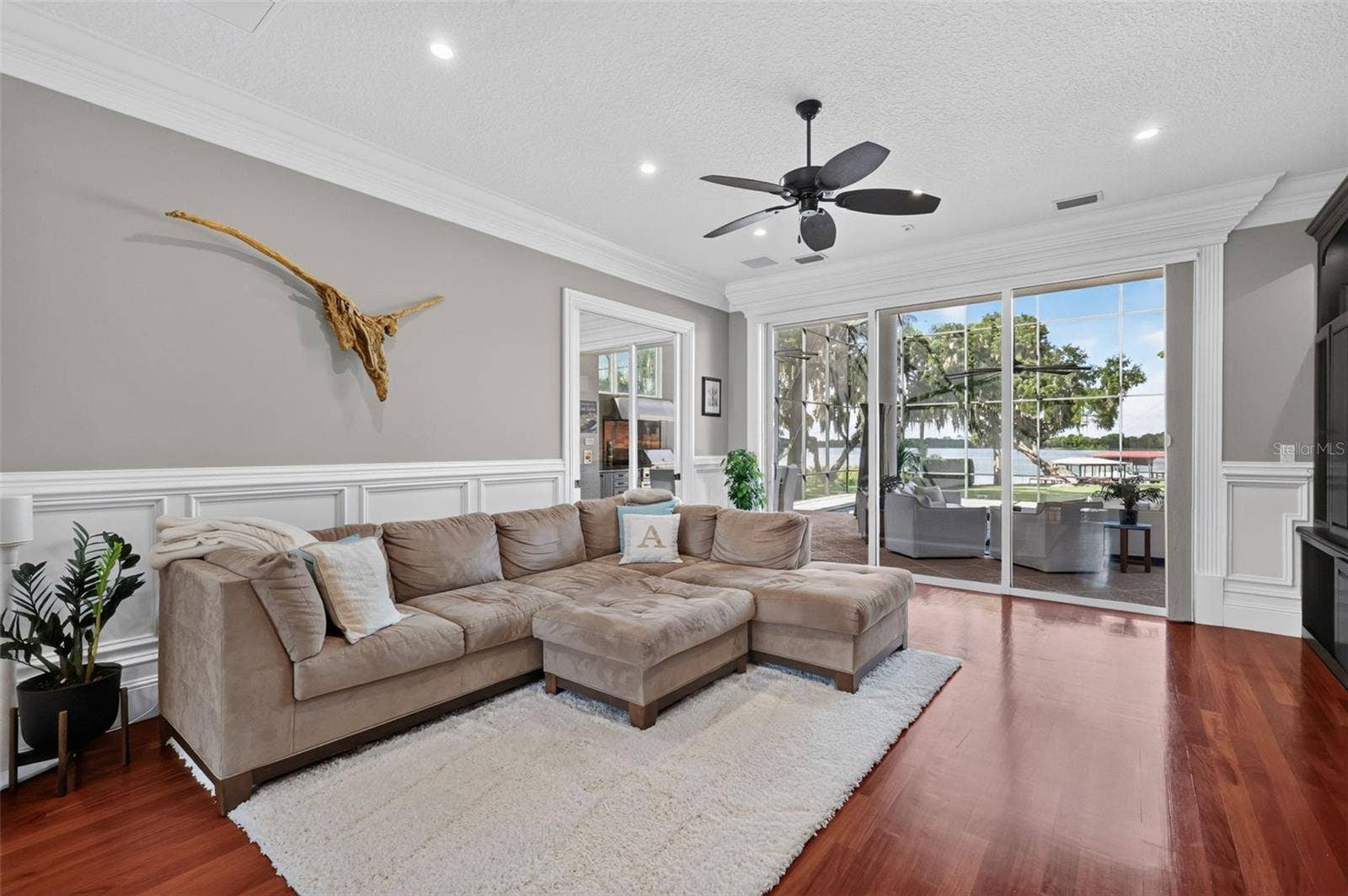 Living Room with with magnificent views of the pool and Lake Carlton