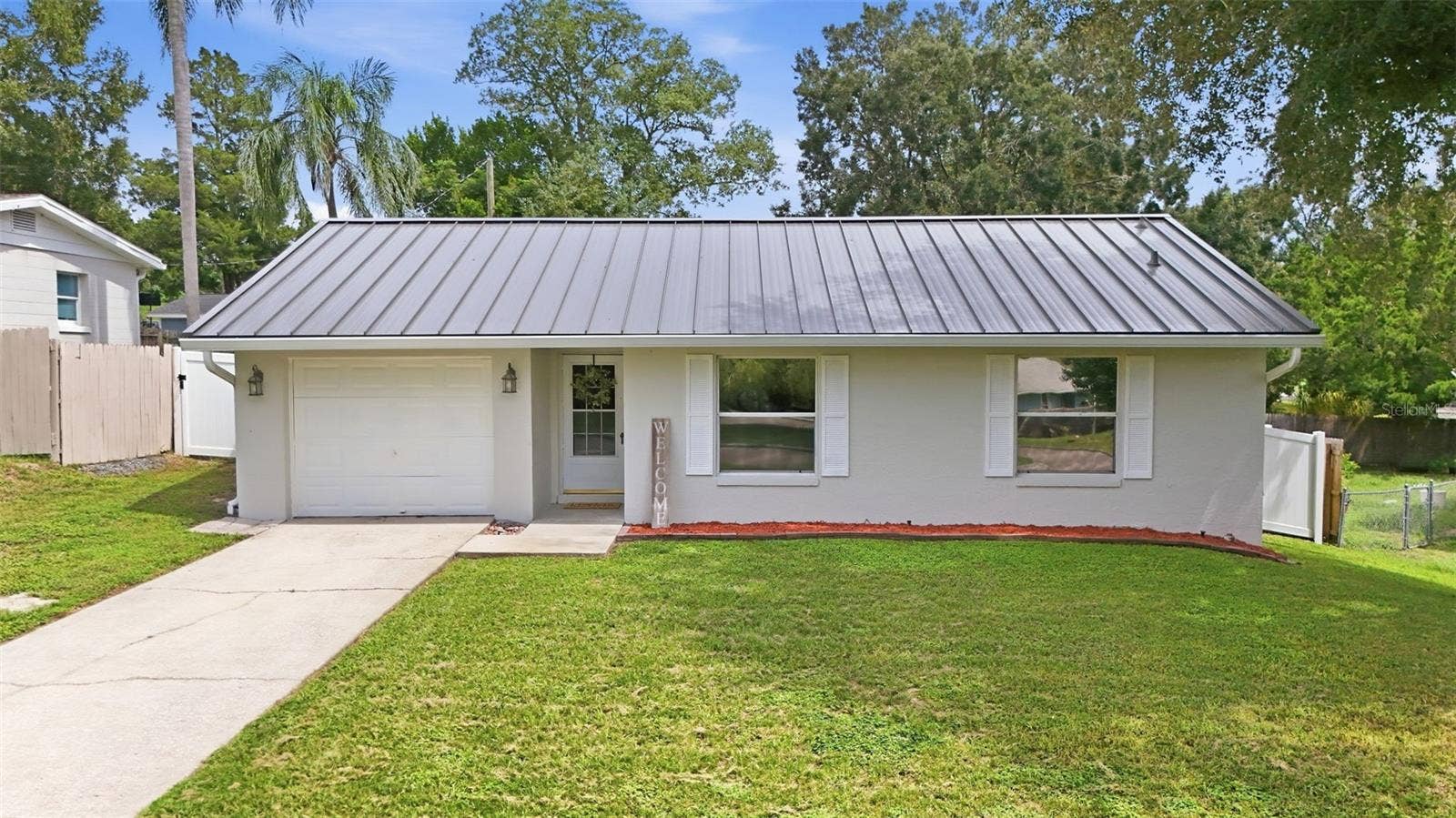 116 LILLIAN STREET, Minneola, FL 34715 Concrete block home in adorable close to all amenities and the Turnpike.
