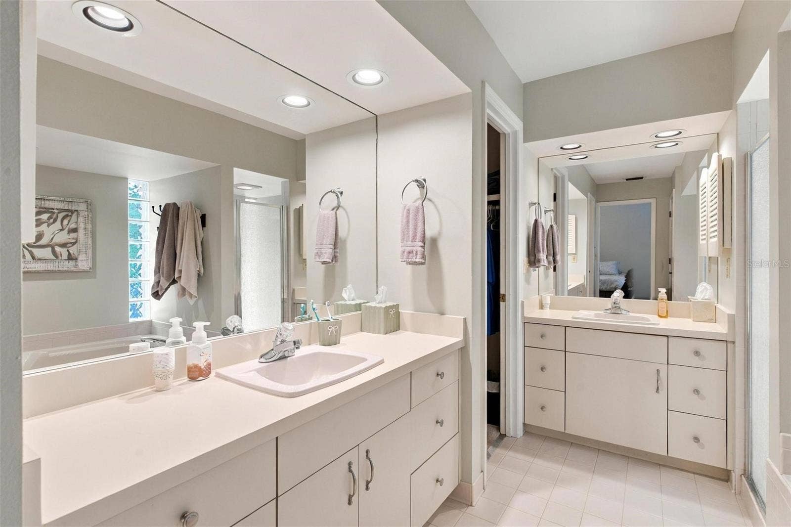 8732 SPRING COURT, Leesburg, FL 34788 Primary Bathroom features 2 vanities, jacuzzi tub, walk in closets, and shower.