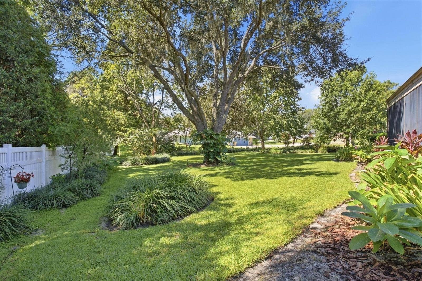 8732 SPRING COURT, Leesburg, FL 34788 Stunning backyard is partially fenced and beautifully landscaped.