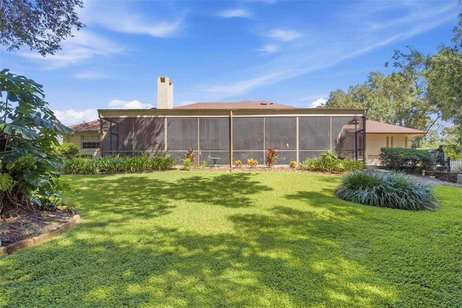8732 SPRING COURT, Leesburg, FL 34788 Stunning backyard is partially fenced and beautifully landscaped.