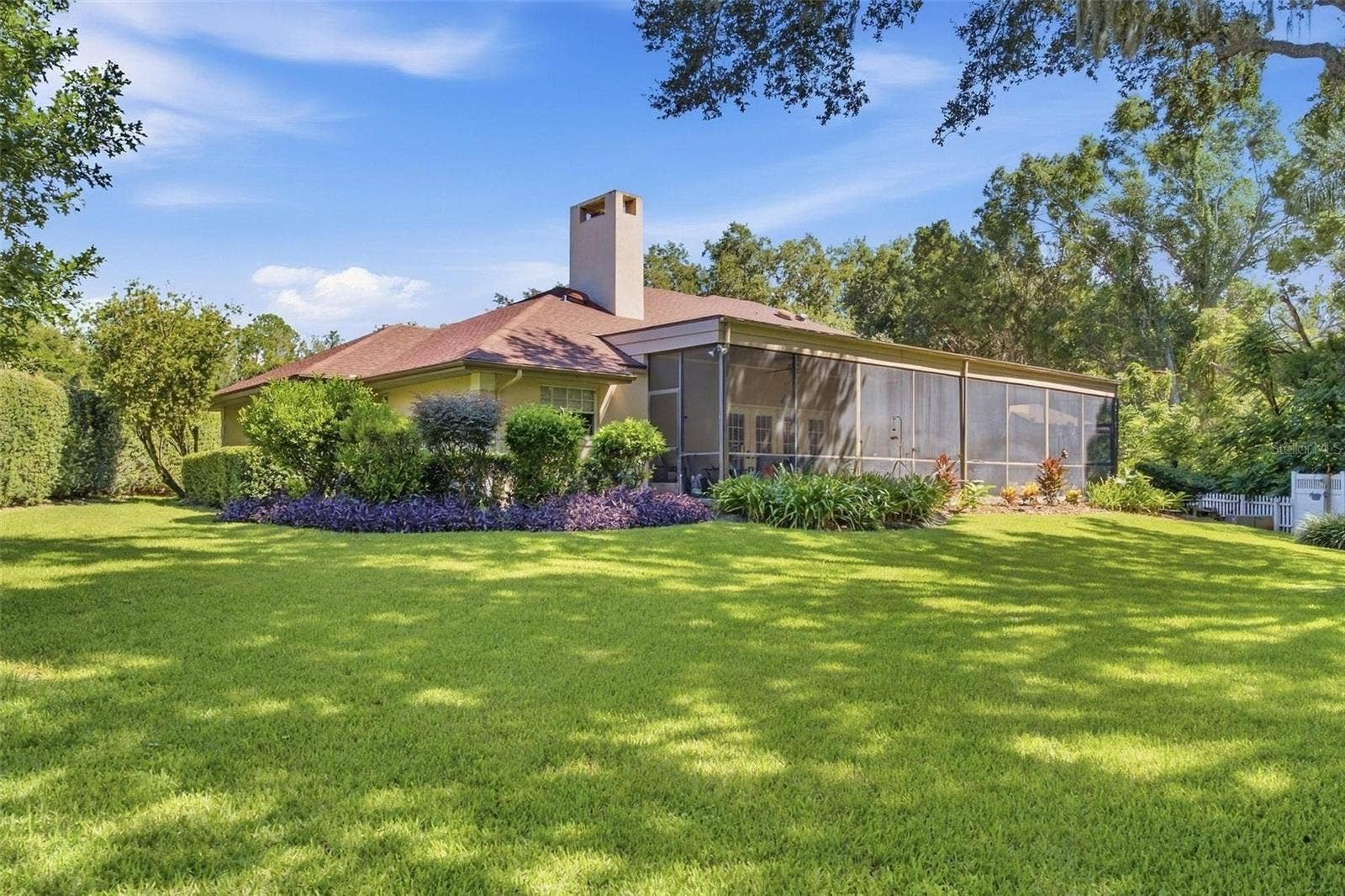 8732 SPRING COURT, Leesburg, FL 34788 Stunning backyard is partially fenced and beautifully landscaped.