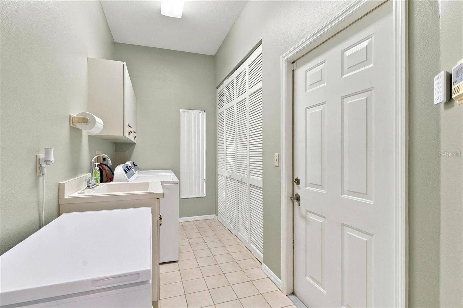8732 SPRING COURT, Leesburg, FL 34788 Large Utility Room is located just of garage by kitchen.