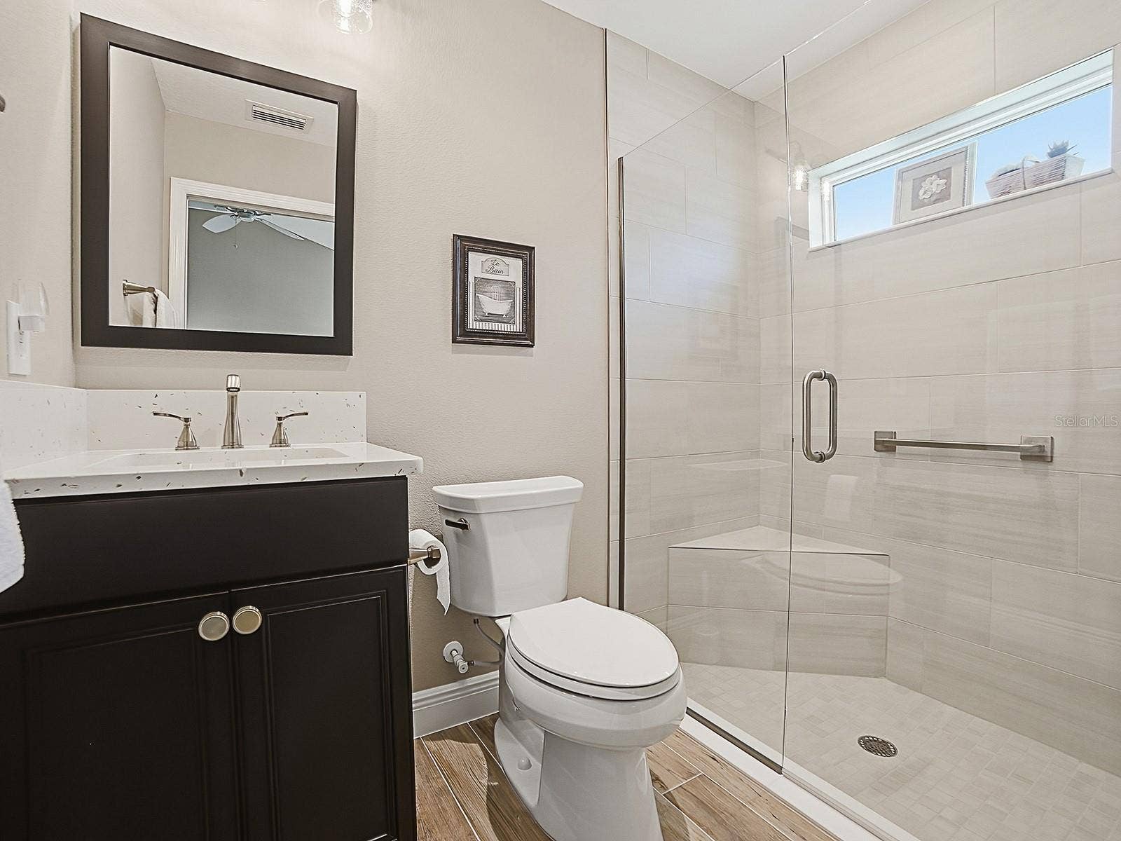 3075 LICCIARDELLO PATH, The Villages, FL 32163 GUEST BATH WITH QUARTZ COUNTERTOPS AND FRAMELESS GLASS SHOWER DOOR.