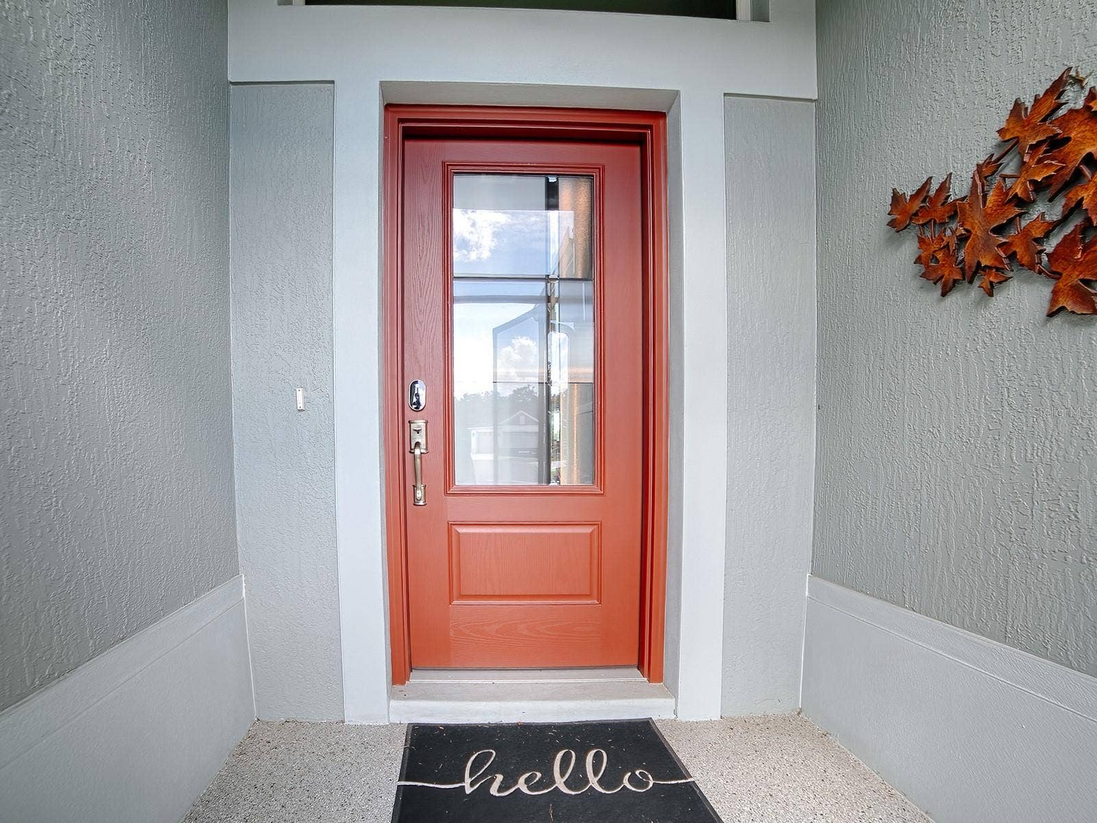 3075 LICCIARDELLO PATH, The Villages, FL 32163 INVITING ENTRANCE WITH A DECORATIVE CONCRETE COATED ENTRANCE AND LEADED GLASS FRONT DOOR.