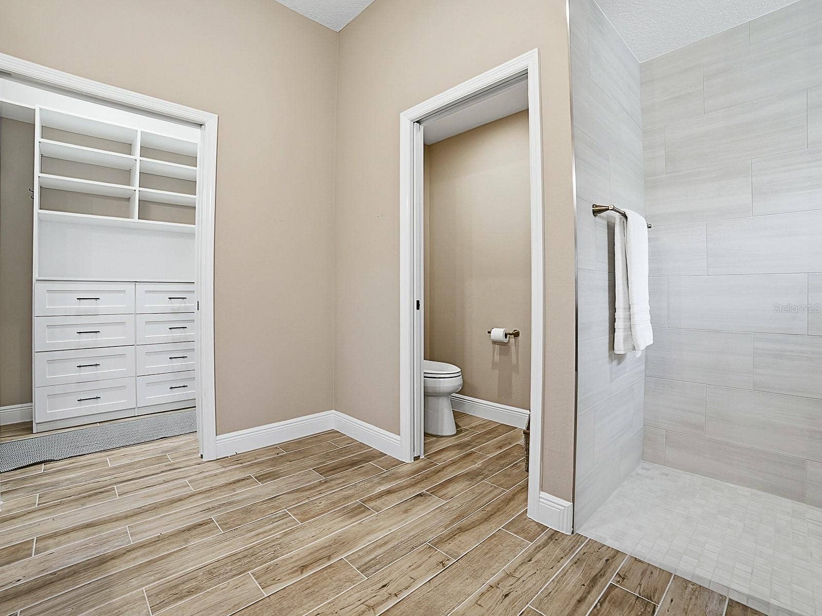 3075 LICCIARDELLO PATH, The Villages, FL 32163 WALK-IN CLOSET TO THE LEFT WITH POCKET DOOR AND BUILT-INS.