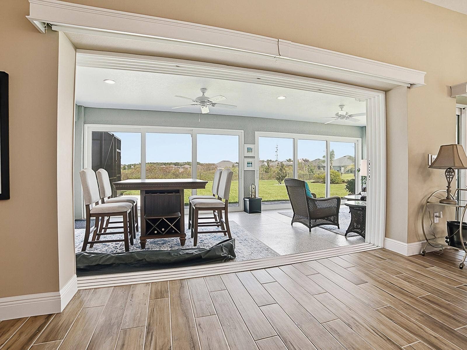 3075 LICCIARDELLO PATH, The Villages, FL 32163 THE SLIDING GLASS DOORS HAVE REMOTE CONTROL PANEL TRACK BLINDS.