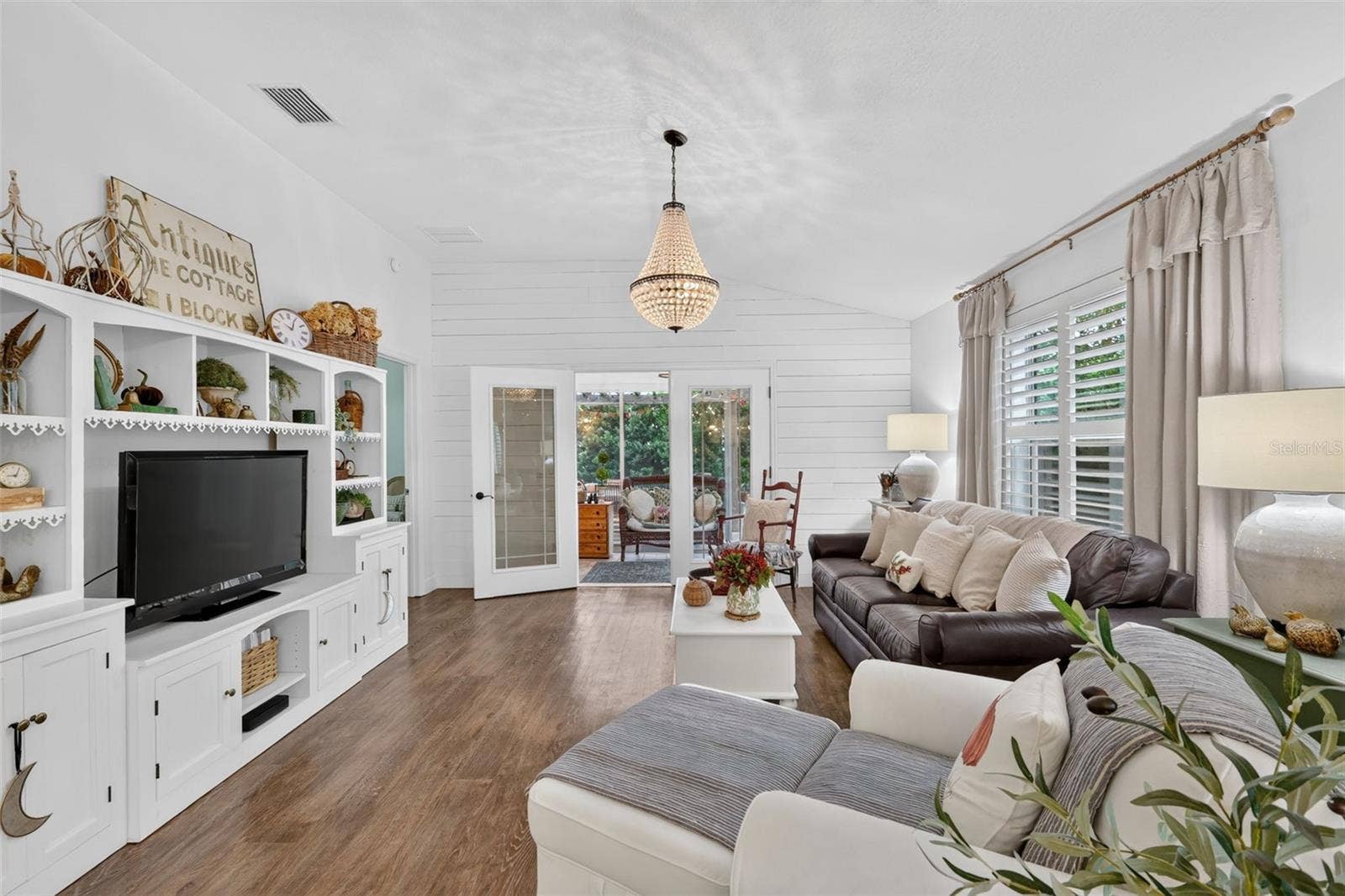 Living Room with View to the Enclosed Lanai