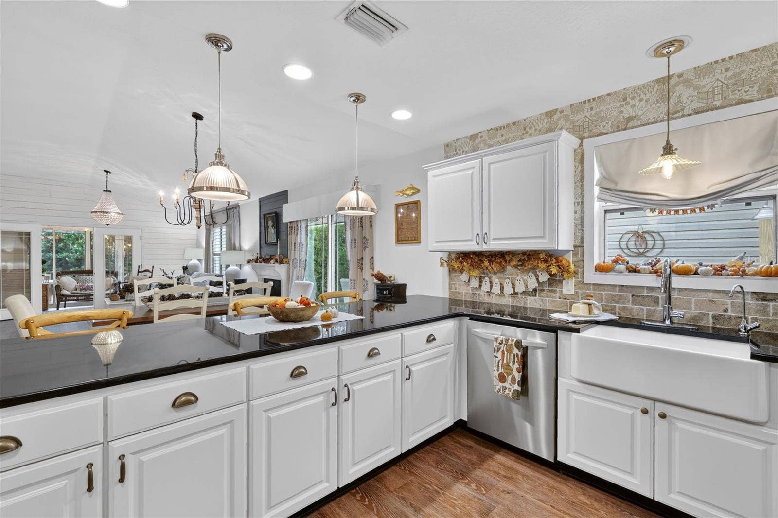 Generous Breakfast Bar Opening to Dining and Living Room