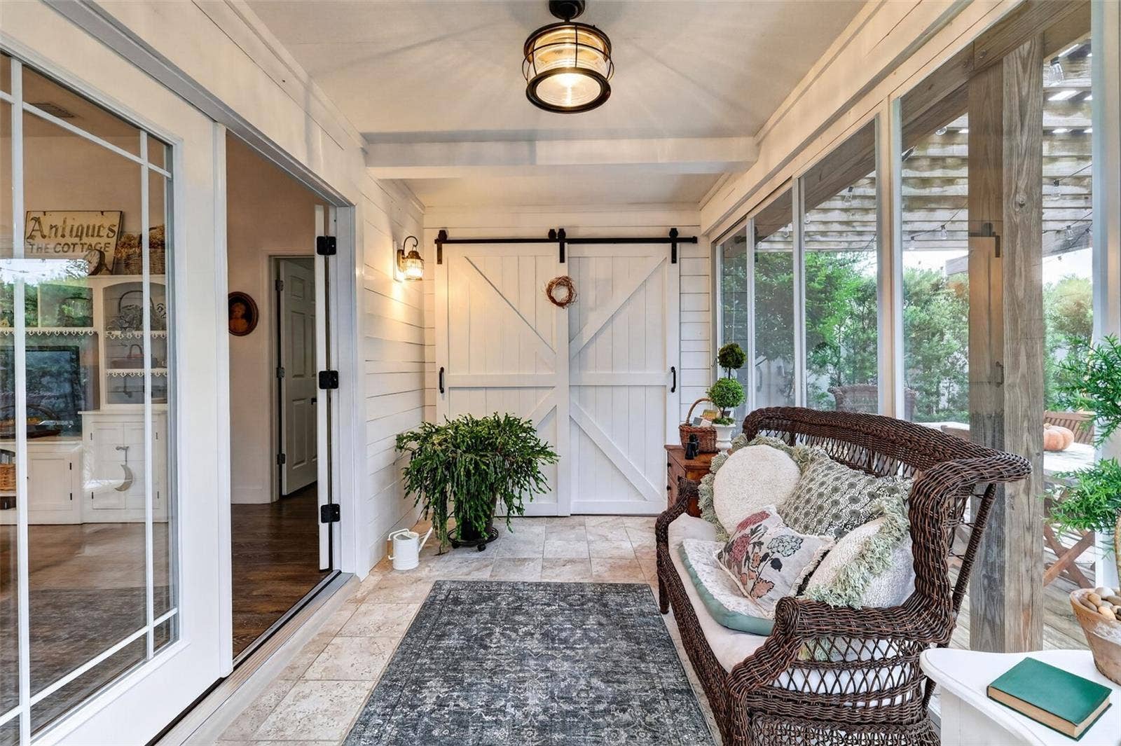 Enclosed Lanai with Barn Door to Sliding Door to Primary Bedroom