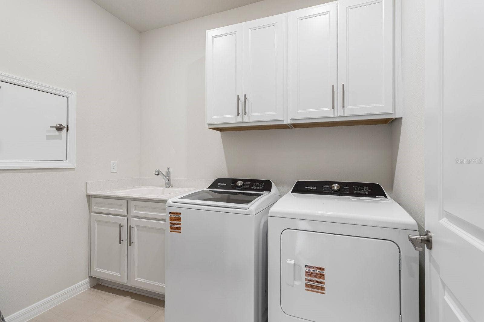 1323 ORANGE VALLEY ROAD, Minneola, FL 34715 Laundry Room with sink and Cabinetry