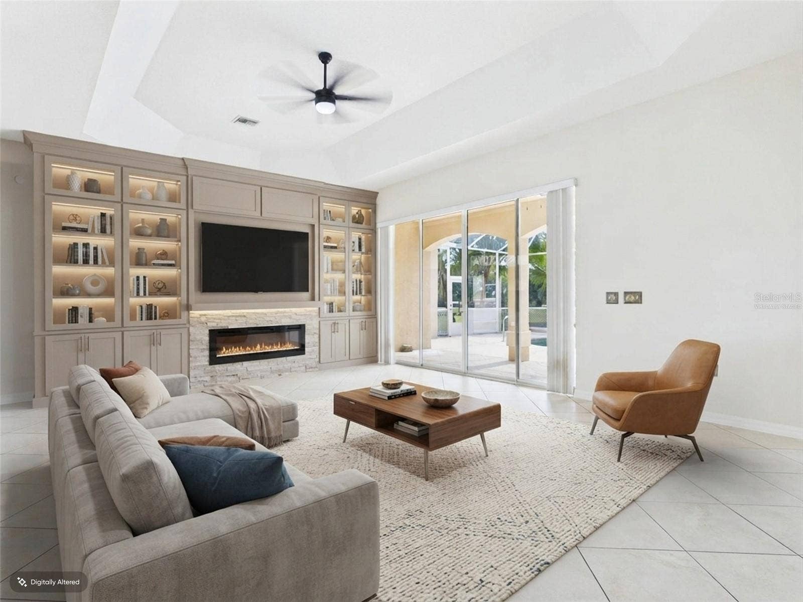 1802 ESTAFANA WAY, The Villages, FL 32159 Living Room w/sliders to Pool - virtually staged
