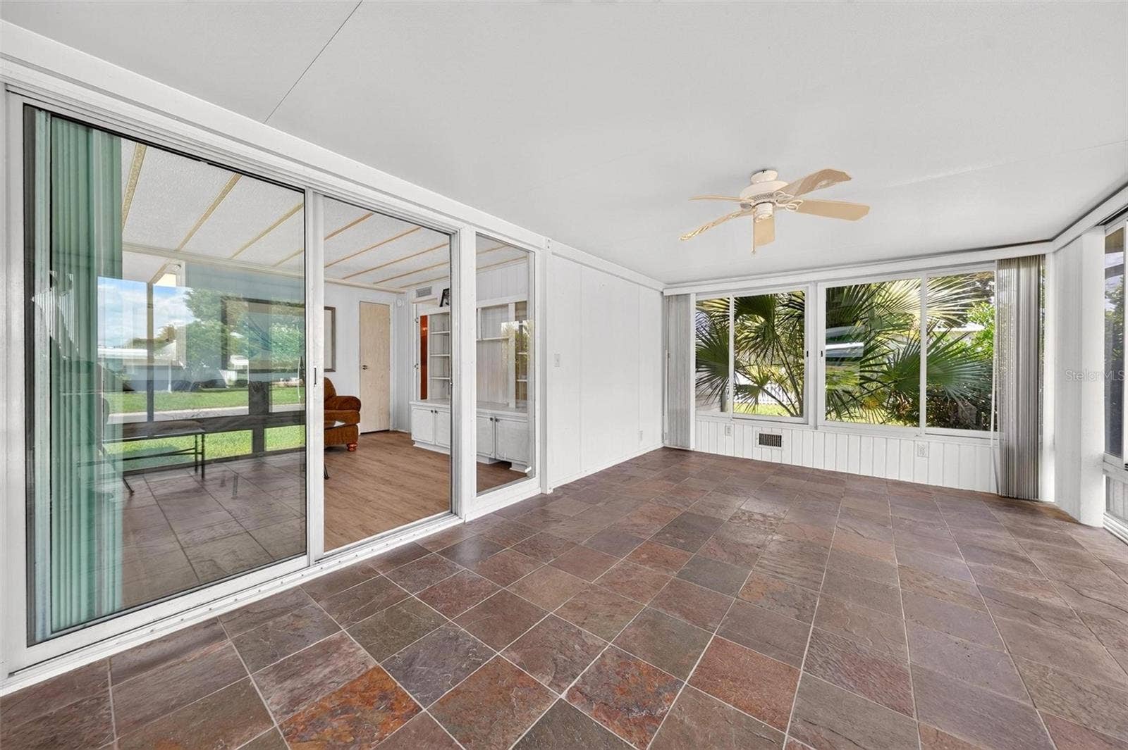 709 BENGAL AVENUE, Tavares, FL 32778 Sliding Door access to Living Room