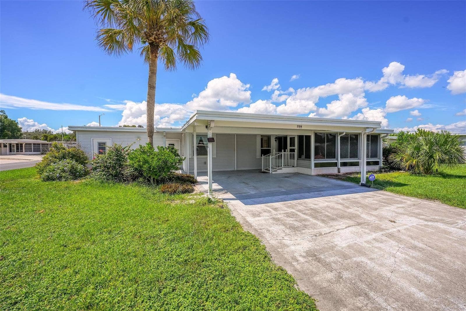 709 BENGAL AVENUE, Tavares, FL 32778 Oversized Driveway & Double Carport