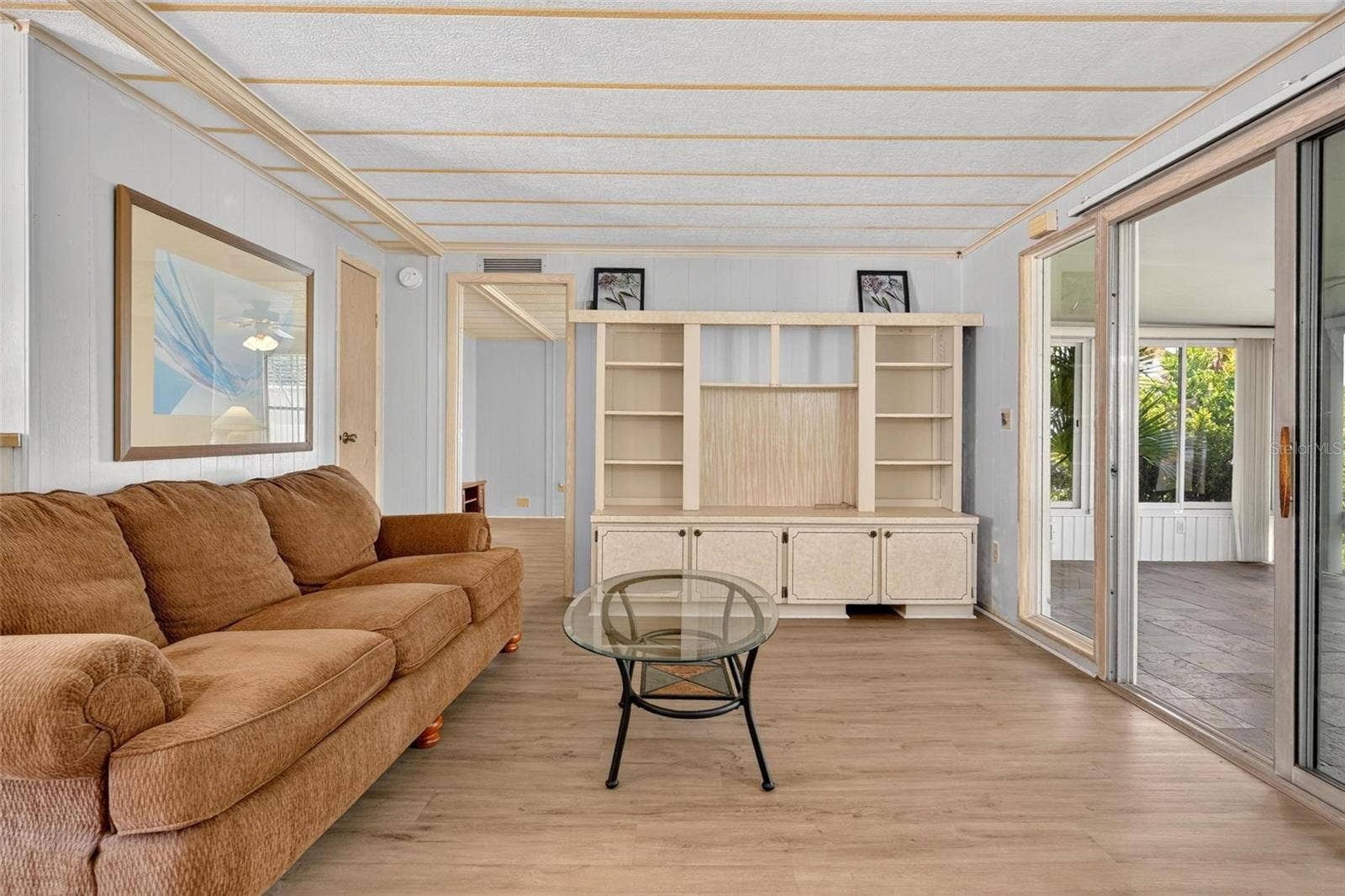 709 BENGAL AVENUE, Tavares, FL 32778 Living Room built-in entertainment center