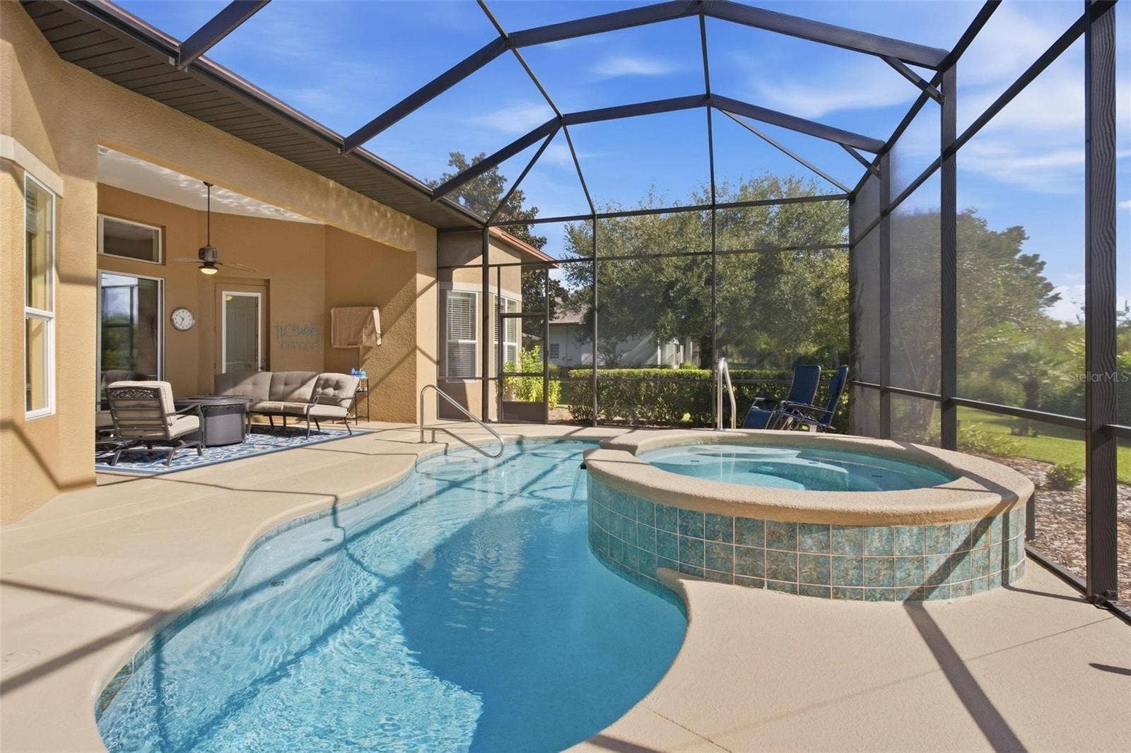 39118 GRIFFIN LANDING, Lady Lake, FL 32159 Complete view of pool area with multiple seating areas for you to relax in.
