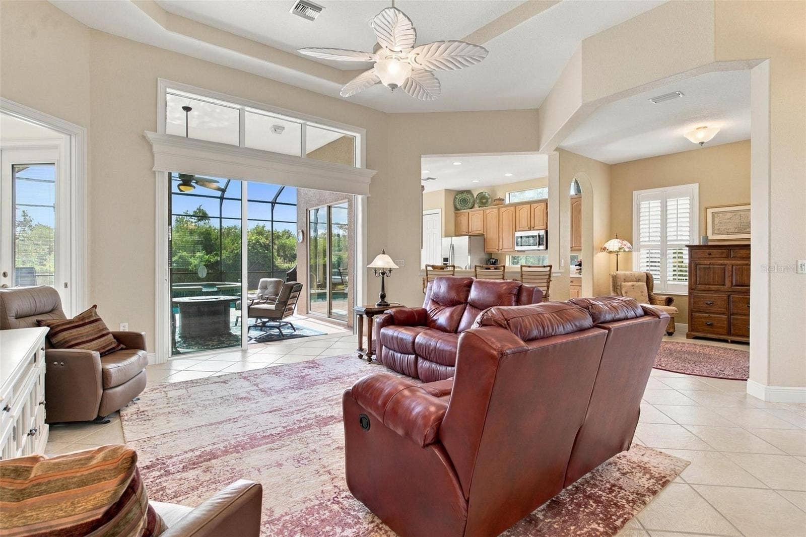 39118 GRIFFIN LANDING, Lady Lake, FL 32159 Great room with sliding glass doors that lead to your relaxing pool.