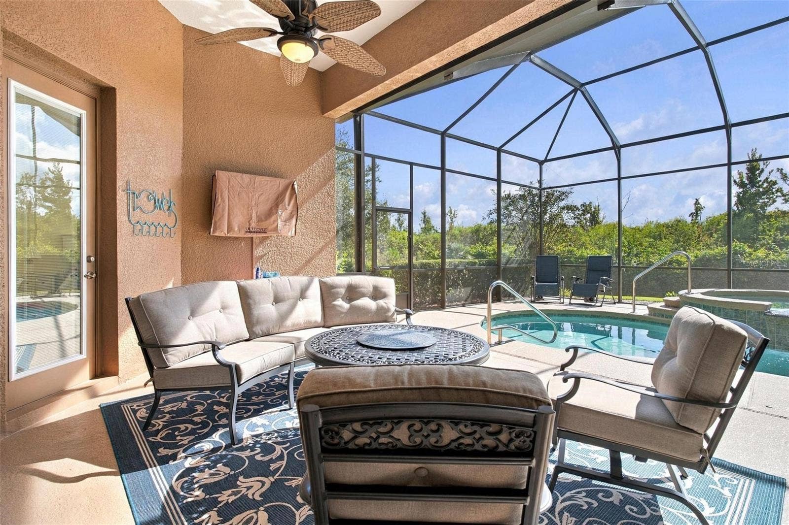 39118 GRIFFIN LANDING, Lady Lake, FL 32159 Seating area outside of pool.