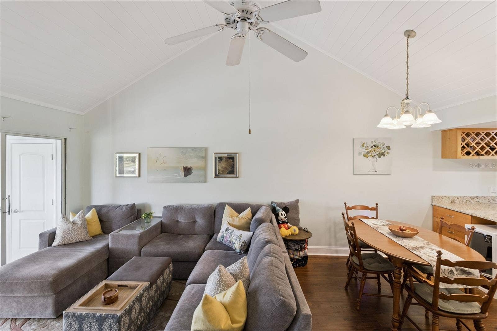 1066 VILLA LANE, #63, Apopka, FL 32712 Tongue-in-groove cathedral ceiling with large fan feels like a resort lounge.