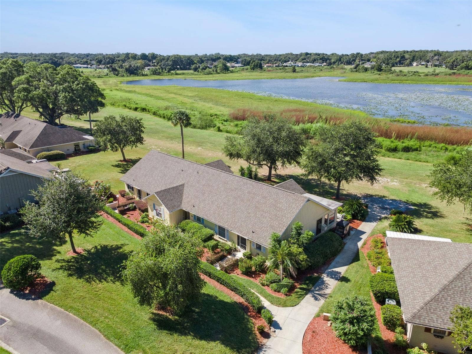 1066 VILLA LANE, #63, Apopka, FL 32712 This home's architecture includes Bahamas-inspired color and roofline outside.