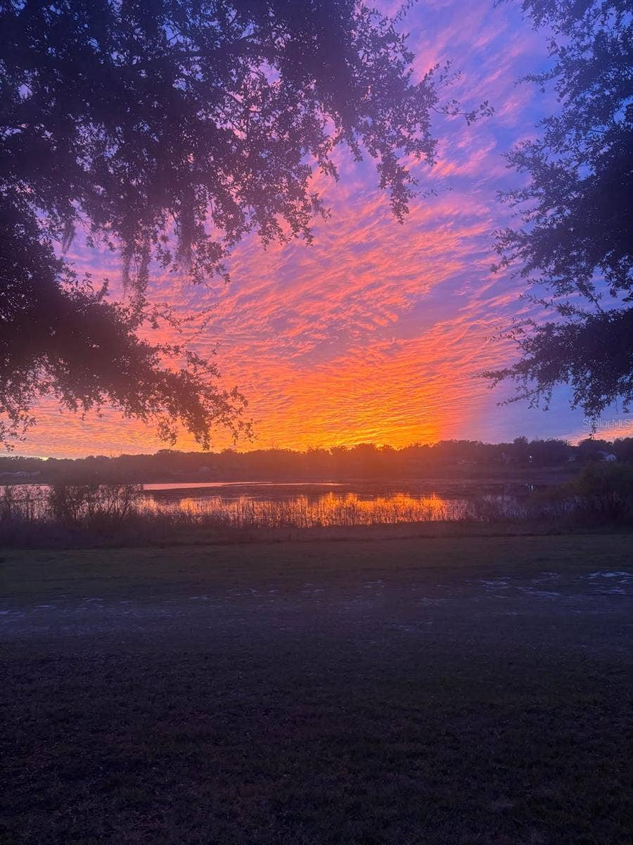 1066 VILLA LANE, #63, Apopka, FL 32712 From your spacious paver patio, watch the glorious sunsets unfold over large Lake Alden with no rear neighbors in the way.